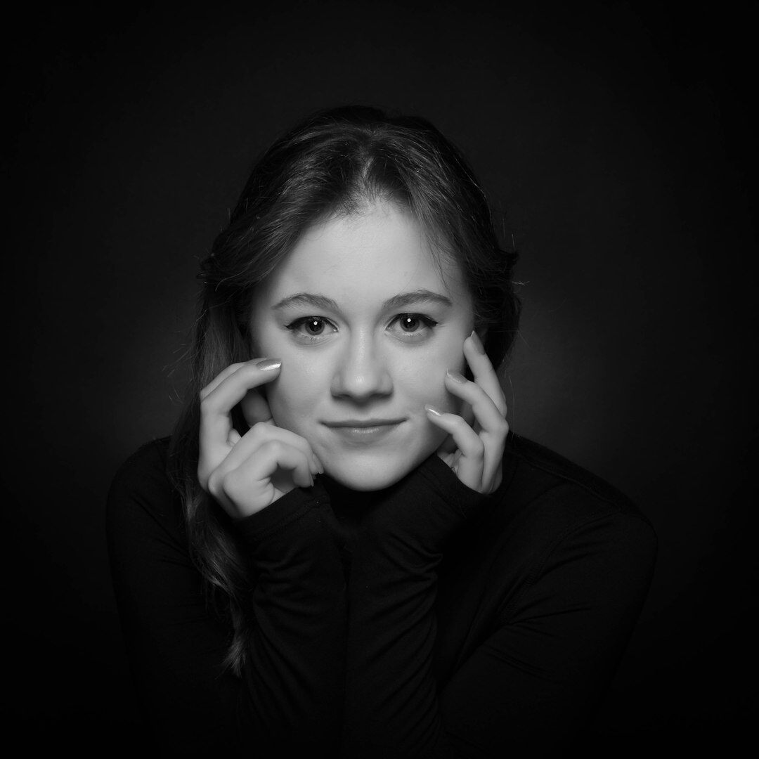 Studio portrait of a smiling woman instructor