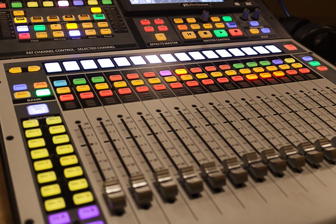 Video switcher panel with multiple source buttons and monitors