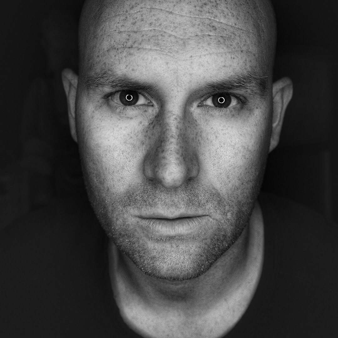 Studio portrait of a man in his 50s, technical director